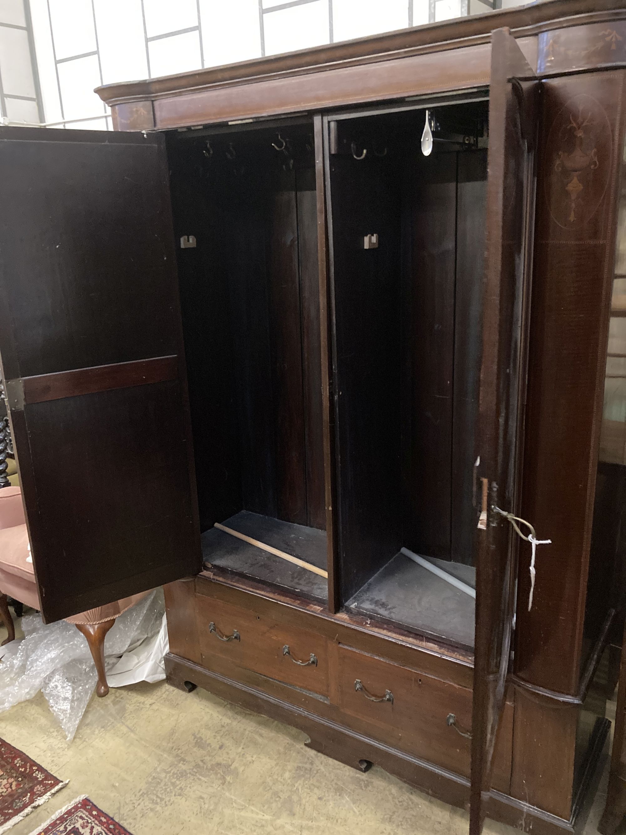 A Victorian inlaid mahogany mirrored wardrobe of two doors, length 146cm, depth 48cm, height 206cm